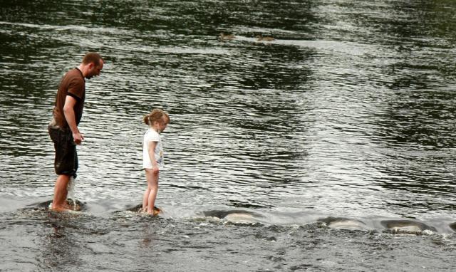 crossing_stepping_stones_in_bolton_abbey_-_england